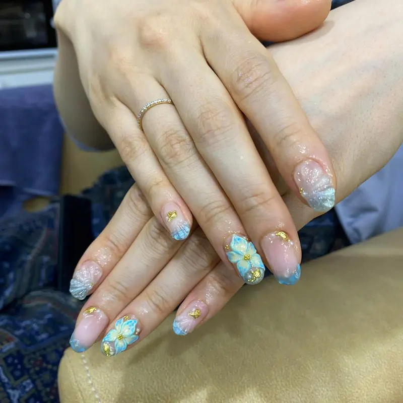 LENA Nails & Beauty Da Nang — Blue Nails with Gold Foil Floral Art