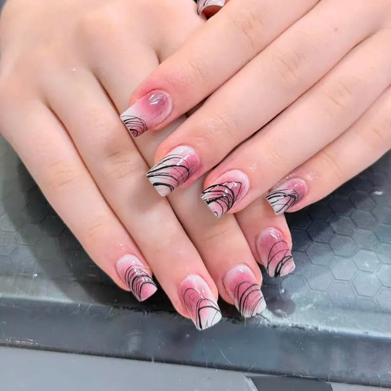 LENA Nails & Beauty Da Nang — Nude Nails with Black & White Marble Swirl Art